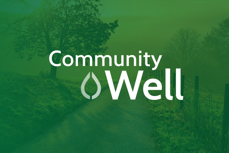 Community Well logo with Water drop icon watermark