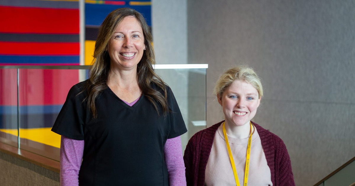 Two Community Alliance Employees smiling