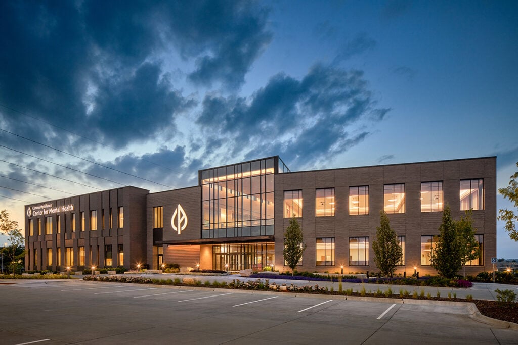 Community Alliance building at dusk