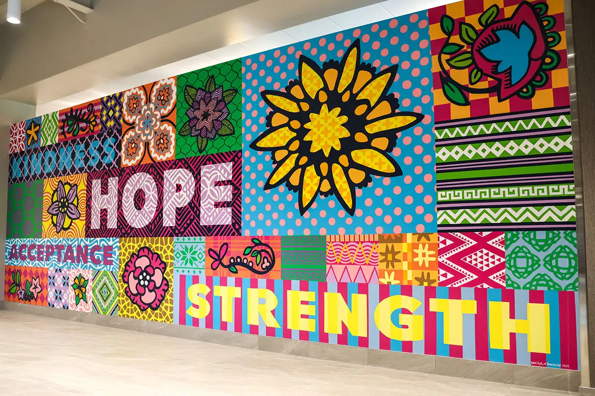 Mosaic on wall with acceptance, kindness, hope, and strength