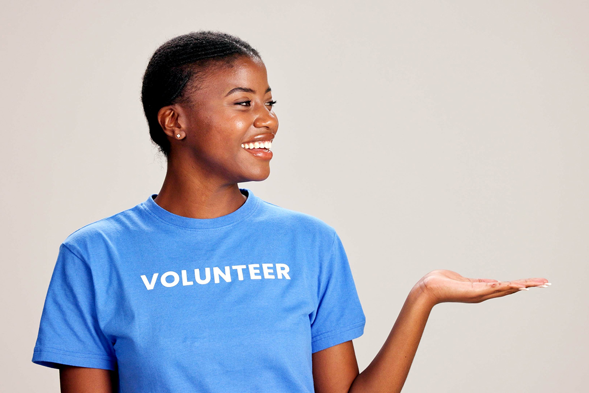 Woman wearing blue volunteer shirt